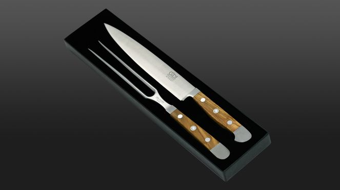 
                    carving cutlery olive with meat fork and slicing knife