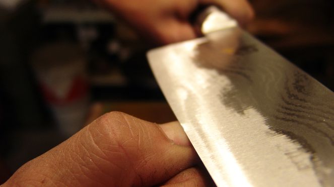 
                    Sharpening of a chef's knife left handed