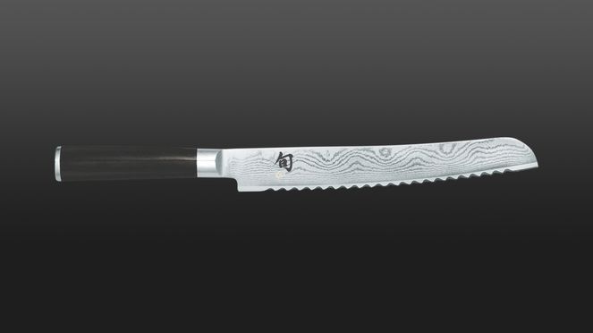 
                    Couteau à pain Shun avec lame en acier damassé