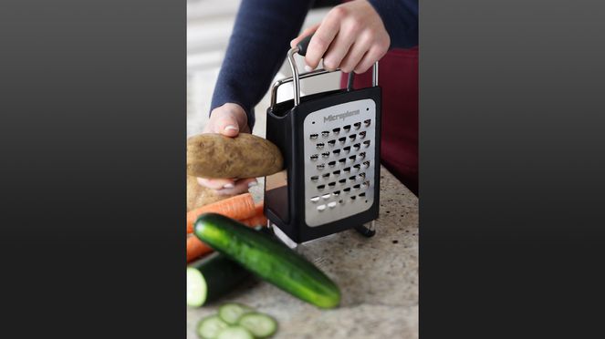 
                    multifunctional grater in use