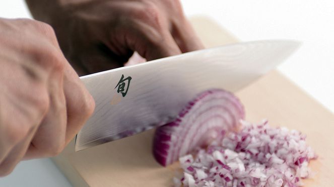 
                    Chef's knife left handed cutting onions