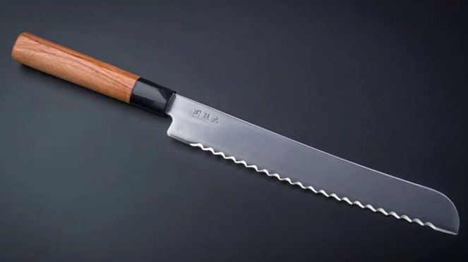 
                    Red Wood bread knife with hard blade steel of 58 Rockwell