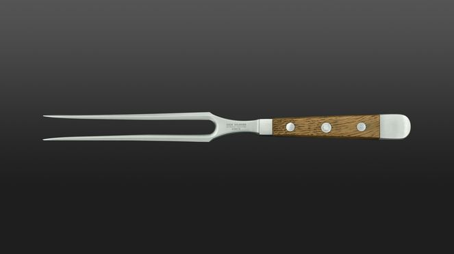 
                    La forchetta per carne Güde con manico di legno di quercia